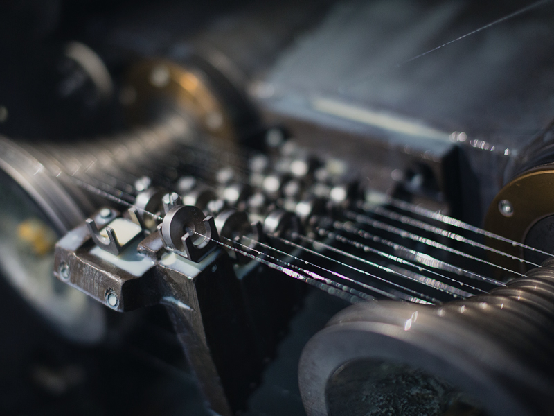 Knitted wire mesh production